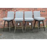 A SET OF FOUR MODERN GREY UPHOLSTERED SWIVEL BAR STOOLS