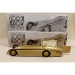 A BOXED SCHYLLING GOLDEN ARROW WIND UP MOTOR MODEL