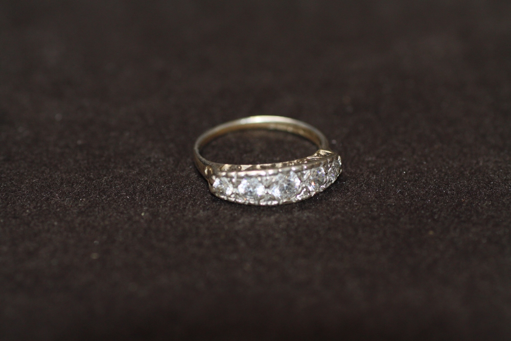 A HALLMARKED SILVER FIVE STONE RING, ring size P