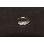 A HALLMARKED SILVER FIVE STONE RING, ring size P