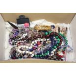 A BOX OF COSTUME JEWELLERY TO INCLUDE A GOLD PLATED BANGLE, SILVER BRACELET ETC