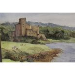 A FRAMED AND GLAZED WATERCOLOUR DEPICTING DUNVEGAN CASTLE, ISLE OF SKYE WITH SHEEP GRAZING IN THE