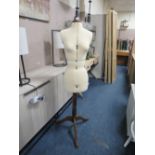 A DRESSMAKERS DUMMY ON STAND