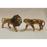 TWO BESWICK GLOSS FINISH FIGURES IN THE FORM OF A LION AND A TIGER
