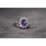 AN 18CT YELLOW GOLD TANZANITE AND DIAMOND CLUSTER RING, Oval-cut tanzanite 2.46ct. RBC diamonds 1.