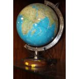 A MODERN ILLUMINATING DESK TOP GLOBE