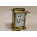 AN ANTIQUE FRENCH BRASS 8 DAY STRIKING MOVEMENT CARRIAGE CLOCK