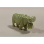 AN ORIENTAL STYLE CARVED HARD STONE HIPPO FIGURE