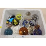 A BOX OF STUDIO GLASS PAPER WEIGHTS