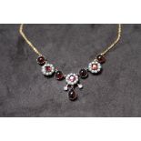 A NECKLACE SET WITH CABOCHON GARNETS, step-cut garnets, seed pearls and diamonds, boxed