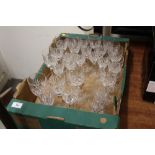 A TRAY OF CUT GLASS DRINKING GLASSES