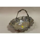 A HALLMARKED SILVER SWING HANDLED FLORALLY EMBOSSED BASKET APPROX WEIGHT - 393.3G