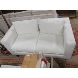A MODERN WHITE TWO SEATER SETTEE