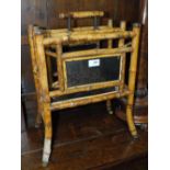 A VICTORIAN BAMBOO AND LACQUERED PAPER RACK