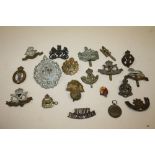 A COLLECTION OF MILITARY CAP BADGES ETC