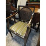 AN ANTIQUE BERGERE ARMCHAIR A/F