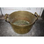 A LARGE ANTIQUE BRASS JAM PAN