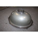 A VINTAGE SILVER PLATED FOOTED TRAY TOGETHER WITH A MATCHED PEWTER SERVING DOME (2)