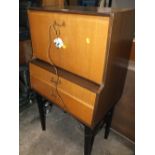 A RETRO TEAK DRINKS CABINET POSSIBLY BY NATHAN H-112 CM W-62 CM