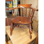 AN ANTIQUE WINDSOR SMOKERS BOW ARMCHAIR