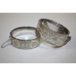 A HALLMARKED SILVER ENGRAVED BANGLE TOGETHER WITH ANOTHER