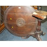 AN ANTIQUE CARVED OAK TILT-TOP PEDESTAL TABLE - DAMAGE TO THE TOP OF THE PEDESTAL