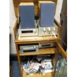 A TEAC HI-FI SYSTEM WITH SPEAKERS IN AN OAK CASE WITH CD'S ETC..