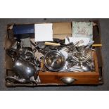 A TRAY OF SILVER PLATED METALWARE TO INCLUDE A TEA SERVICE, FLATWARE ETC.