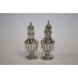 A PAIR OF HALLMARKED SILVER PEPPERETTES APPROX WEIGHT - 55G