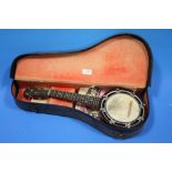 A 'THE WHIRL' BANJOLELE IN FITTED CASE