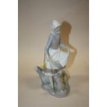 A LLADRO FIGURE OF A LADY AND A RABBIT