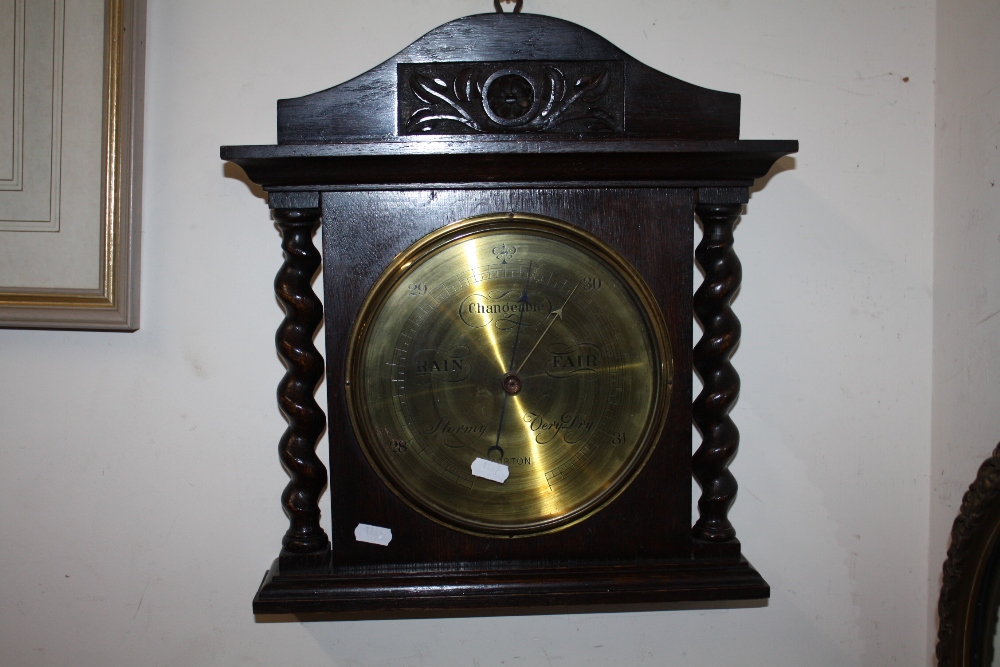 A VINTAGE OAK BARLEY TWIST WALL BAROMETER BY MORTON