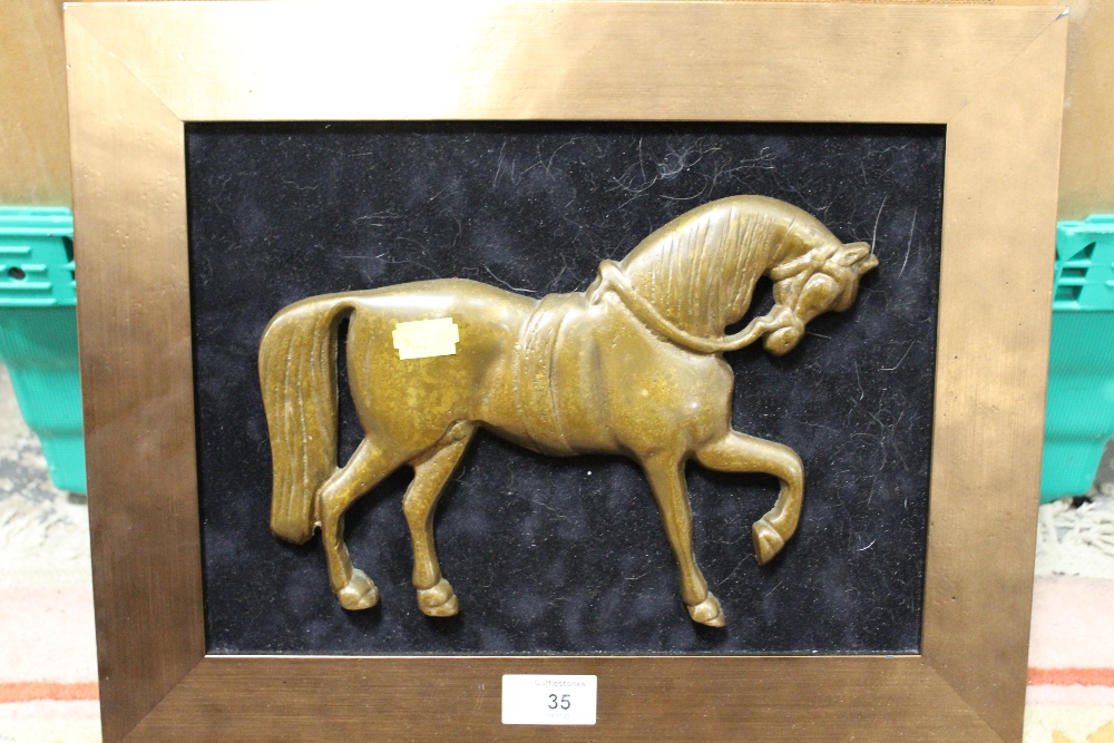 A BRONZE TYPE WALL MOUNTABLE PLAQUE OF A HORSE