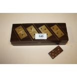 A VINTAGE TREEN AND BRASS DOMINOES SET