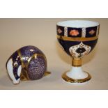 A ROYAL CROWN DERBY BADGER PAPER WEIGHT, TOGETHER WITH A ROYAL CROWN DERBY STYLE CHALICE SIGNED M.