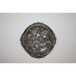 A LARGE FIGURATIVE EMBOSSED BROOCH STAMPED KENARD SILVER