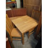 A MODERN SMALL SQUARE LIGHT OAK TABLE AND TWO CHAIRS TABLE H-77 CM W-75 CM