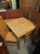 A MODERN SMALL SQUARE LIGHT OAK TABLE AND TWO CHAIRS TABLE H-77 CM W-75 CM