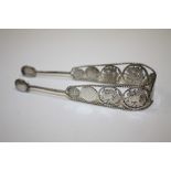 A PAIR OF ANTIQUE SILVER SUGAR TONGUES