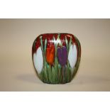 A SIGNED ANITA HARRIS ART POTTERY CROCUS PATTERN PURSE VASE