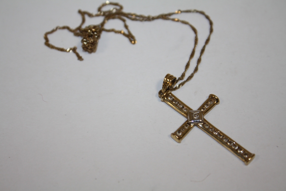 A 9K GOLD DIAMOND SET CROSS PENDANT ON CHAIN (CHAIN A/F)