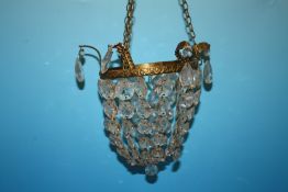 A SMALL GILT METAL AND CRYSTAL CHANDELIER