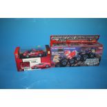A BOXED MONSTER MACHINES CLIMBING MACHINE TOGETHER WITH A X-Q TOYS REMOTE CONTROL FERRARI