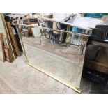 A LARGE OVERMANTLE MIRROR WITH MIRRORED FRAME
