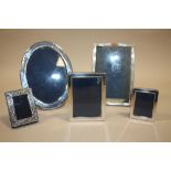 A COLLECTION OF FIVE SILVER PICTURE FRAMES