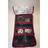 A ROLL BAG OF ASSORTED COSTUME JEWELLERY