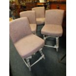 A SET OF 4 MODERN UPHOLSTERED SWIVEL BAR STOOLS