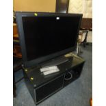 A SONY BRAVIA FLATSCREEN 40" TV ON MODERN STAND - REMOTE HOUSE CLEARANCE