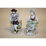 A PAIR OF CONTINENTAL STYLE CERAMIC FIGURES