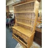 A PINE KITCHEN DRESSER WITH THREE DRAWERS H-204 W-126 CM